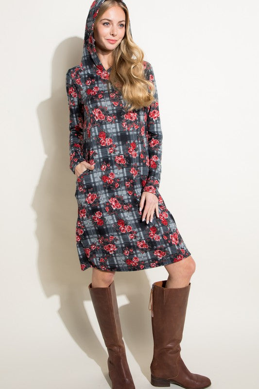 Model showing pockets from the front of FLORAL PLAID PRINT SIDE POCKET HOODIE MINI DRESS
