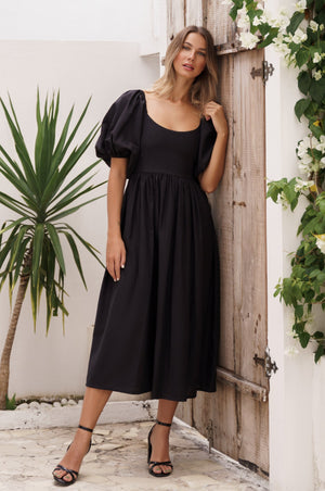 Model standing showing Cherie Puff Sleeve Midi dress-black