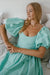 Front view of Cherie Puff Sleeve Midi dress- tosca