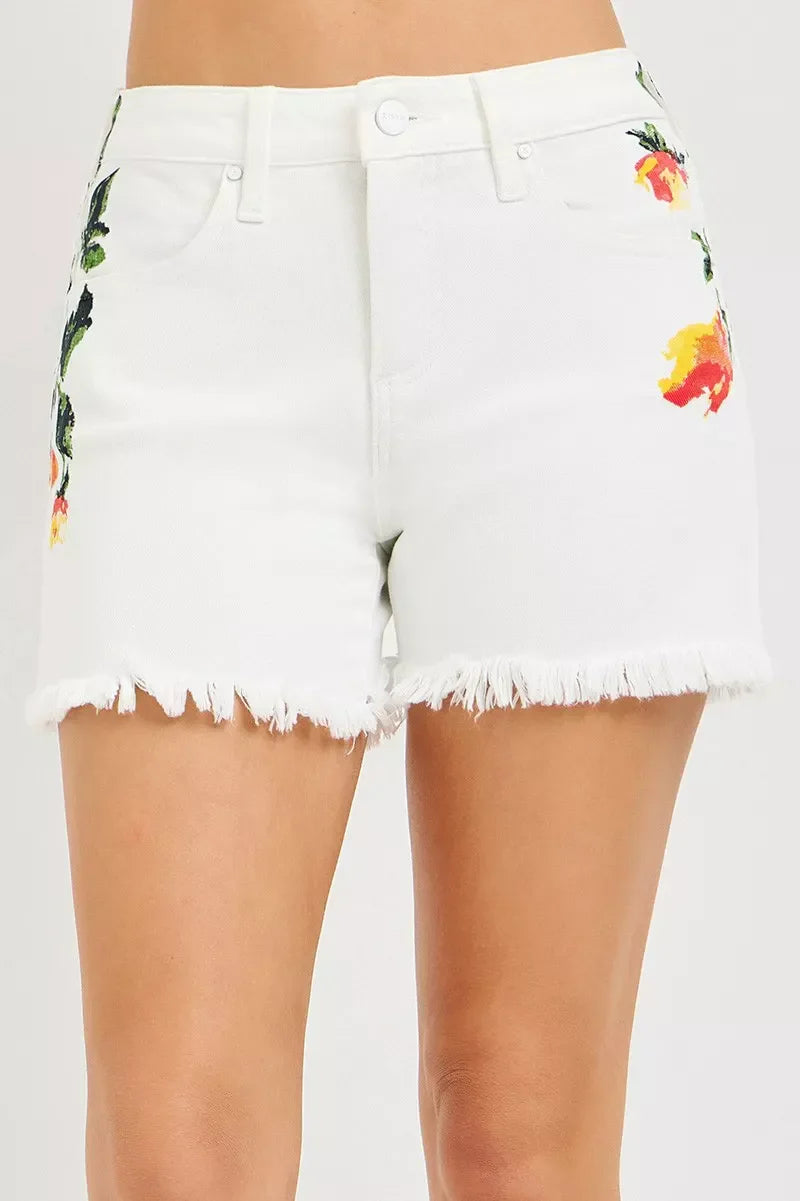 Woman wearing white jean shorts