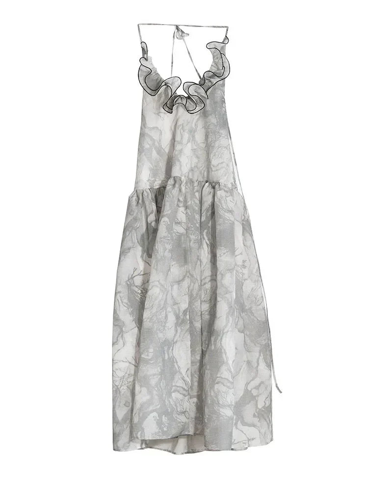 A picture of a vintage 70's gray dress