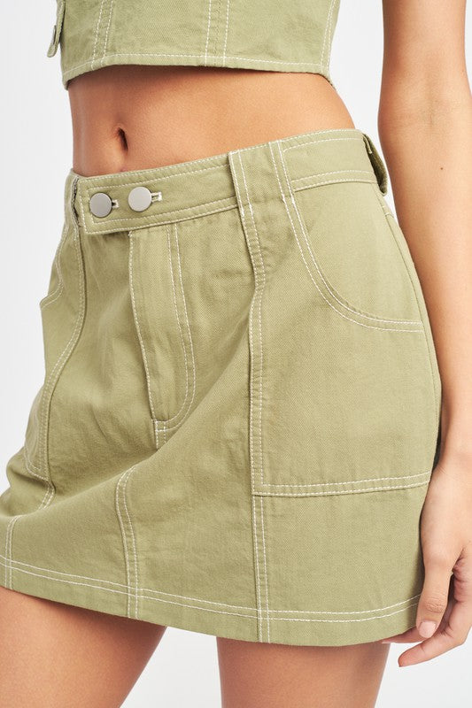 Woman wearing light green mini skirt