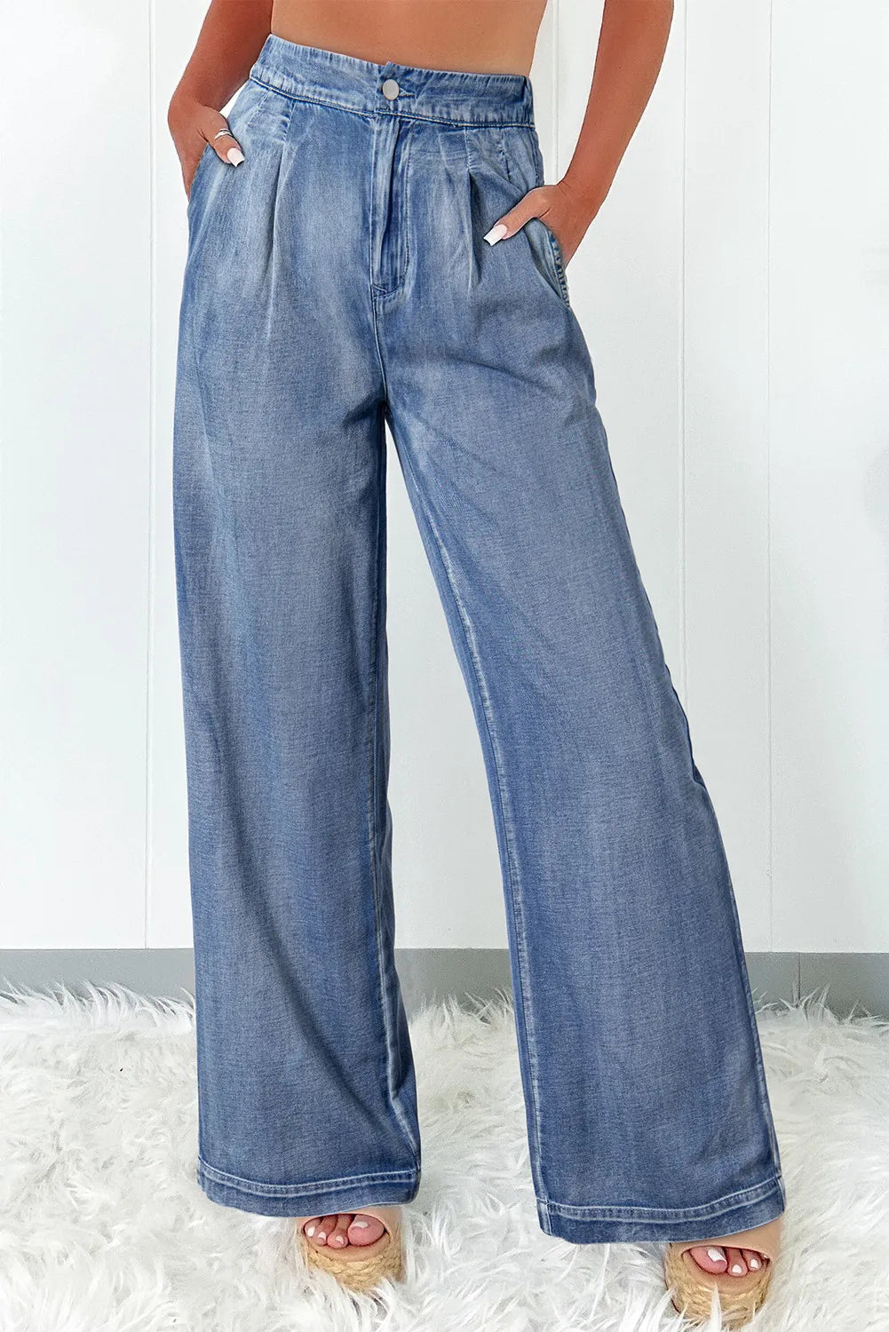 Woman wearing high waist wide leg jeans