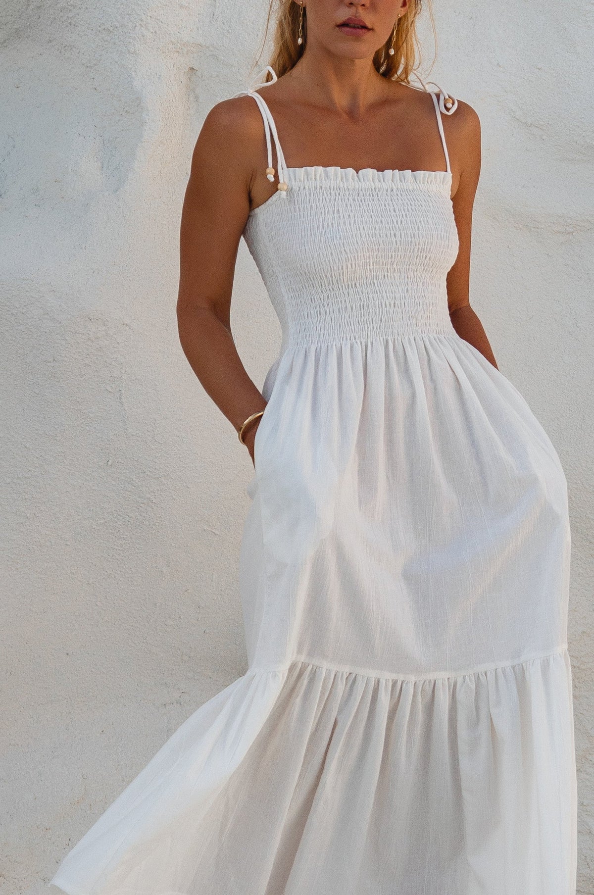 Woman wearing white midi dress