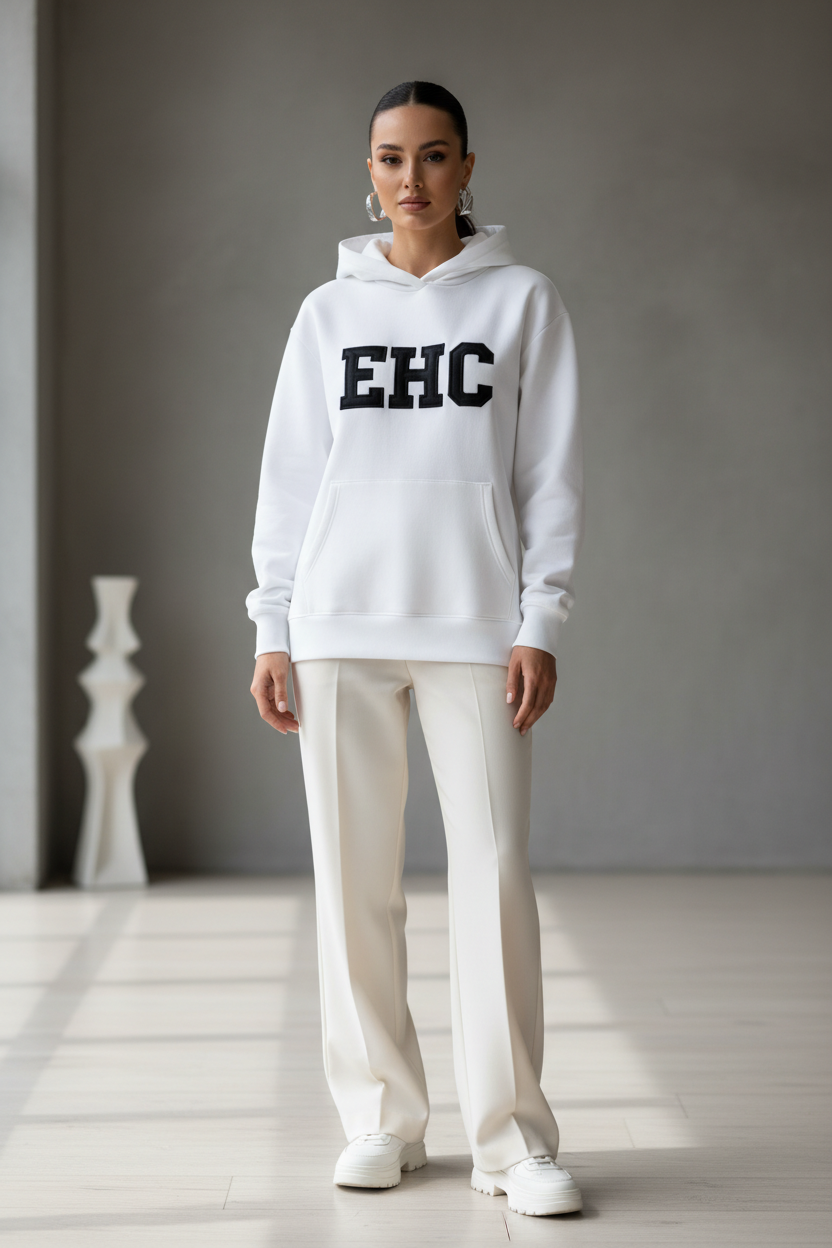 Woman wearing a white EHC hoodie