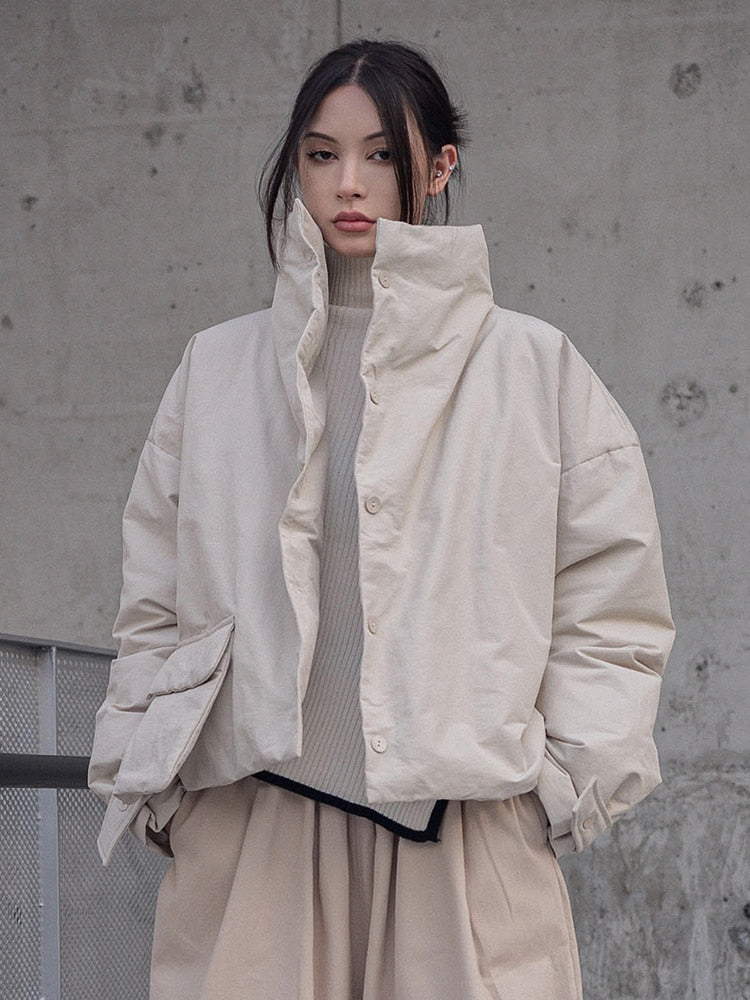 Young lady wearing beige jacket