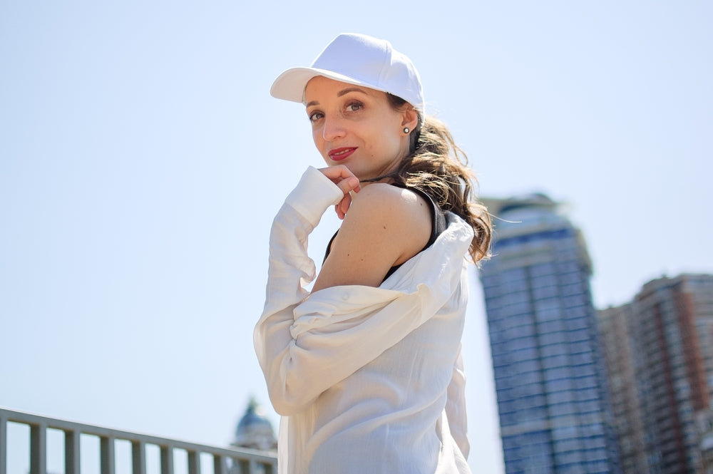Woman wearing white long sleeve top