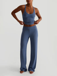 Person wearing a blue athletic outfit on a light gray background