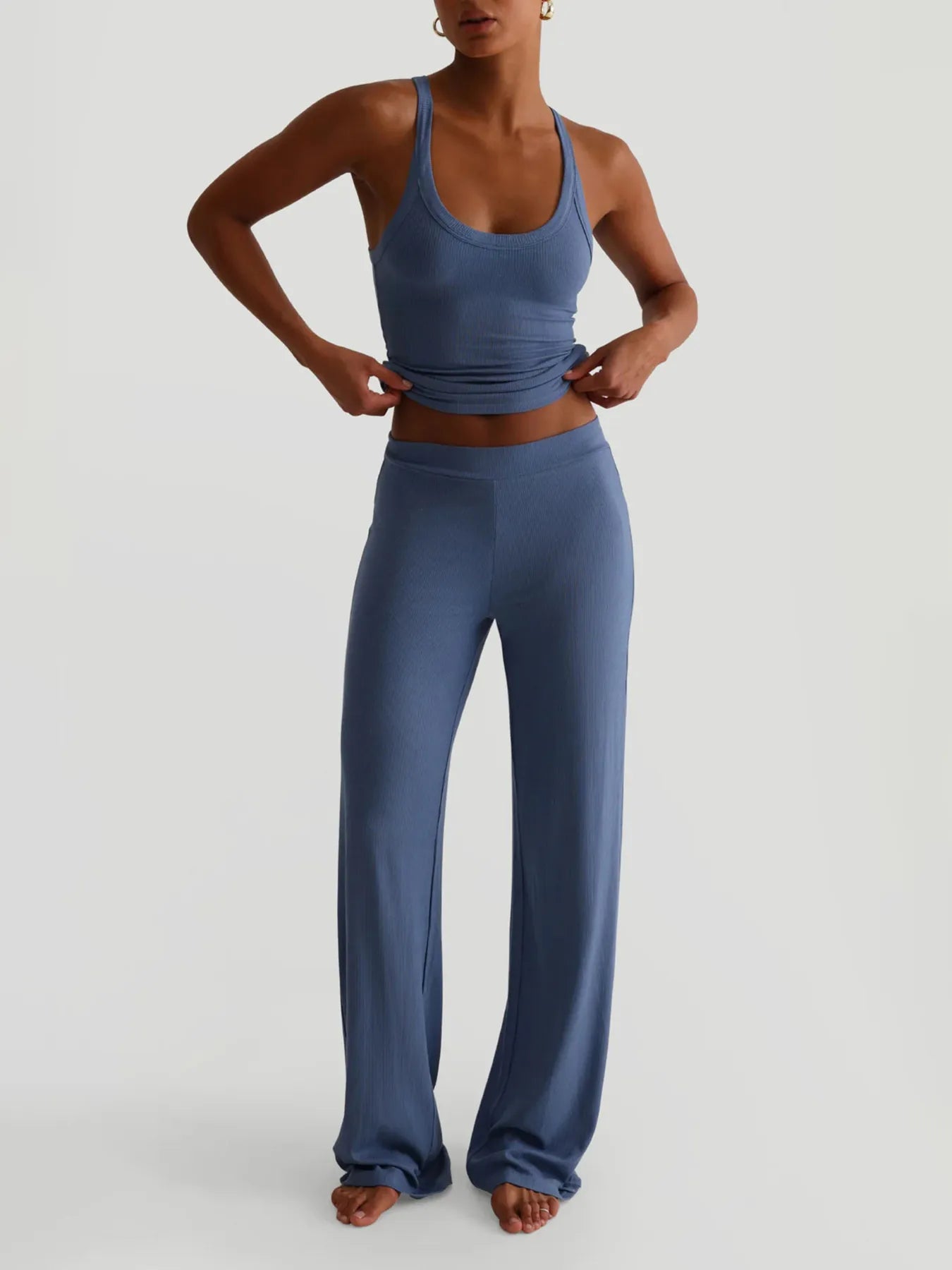 Person wearing a blue athletic outfit on a light gray background