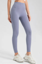 Person wearing light purple leggings on a white background
