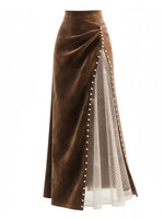 Brown velvet skirt with white mesh panel and decorative buttons on a white background