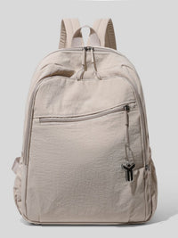 Beige backpack with a visible brand logo on a light gray background