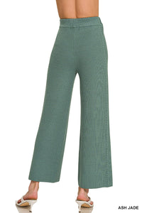 Green wide-leg pants on a white background