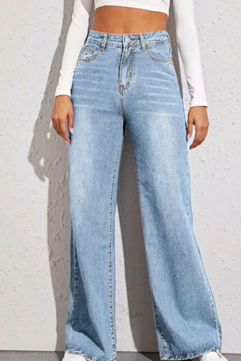 Light blue wide-leg jeans worn by a person against a white background