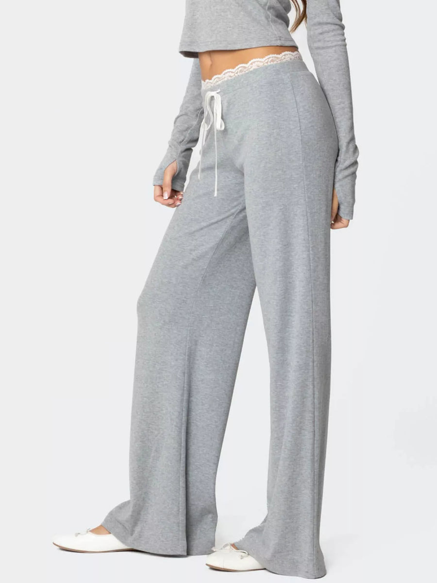 Gray lounge set with wide-leg pants and long-sleeve top on a white background
