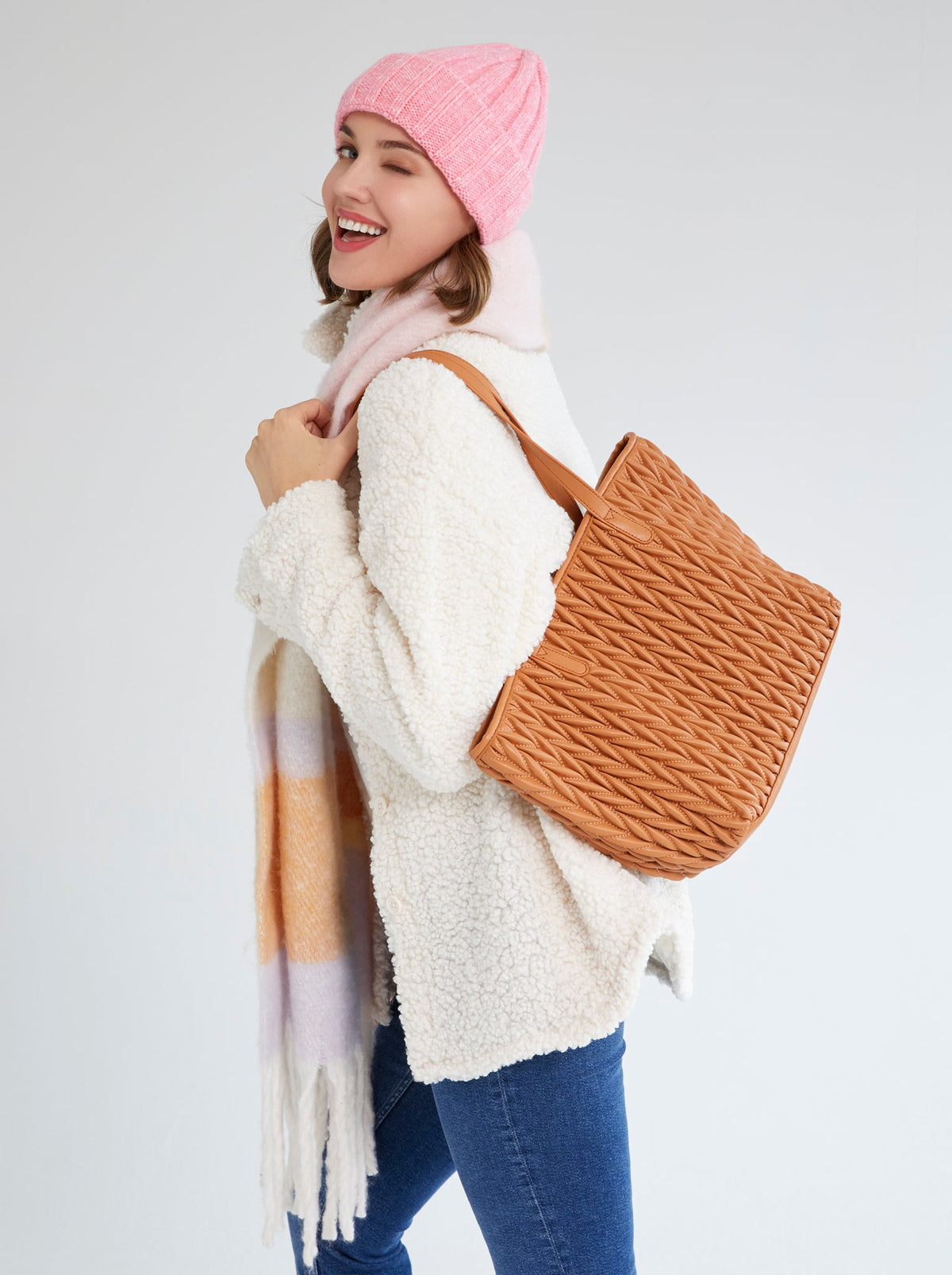 woman showing the side of pink winter hat