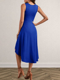 Woman wearing a blue dress with a neutral background