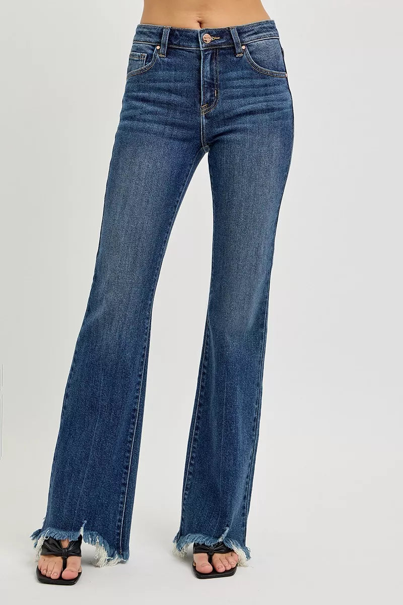 Blue jeans with frayed hems on a white background