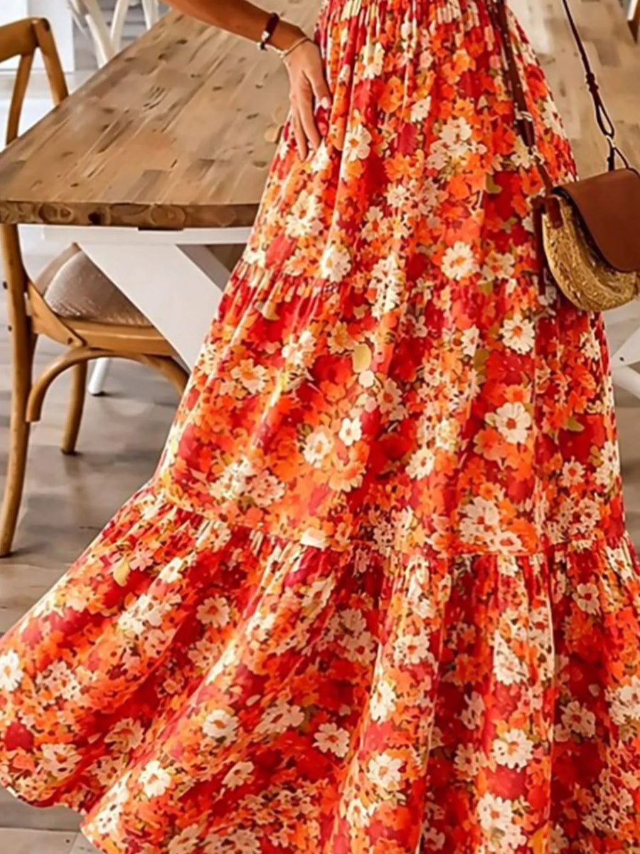 Person wearing a red floral dress in a casual indoor setting
