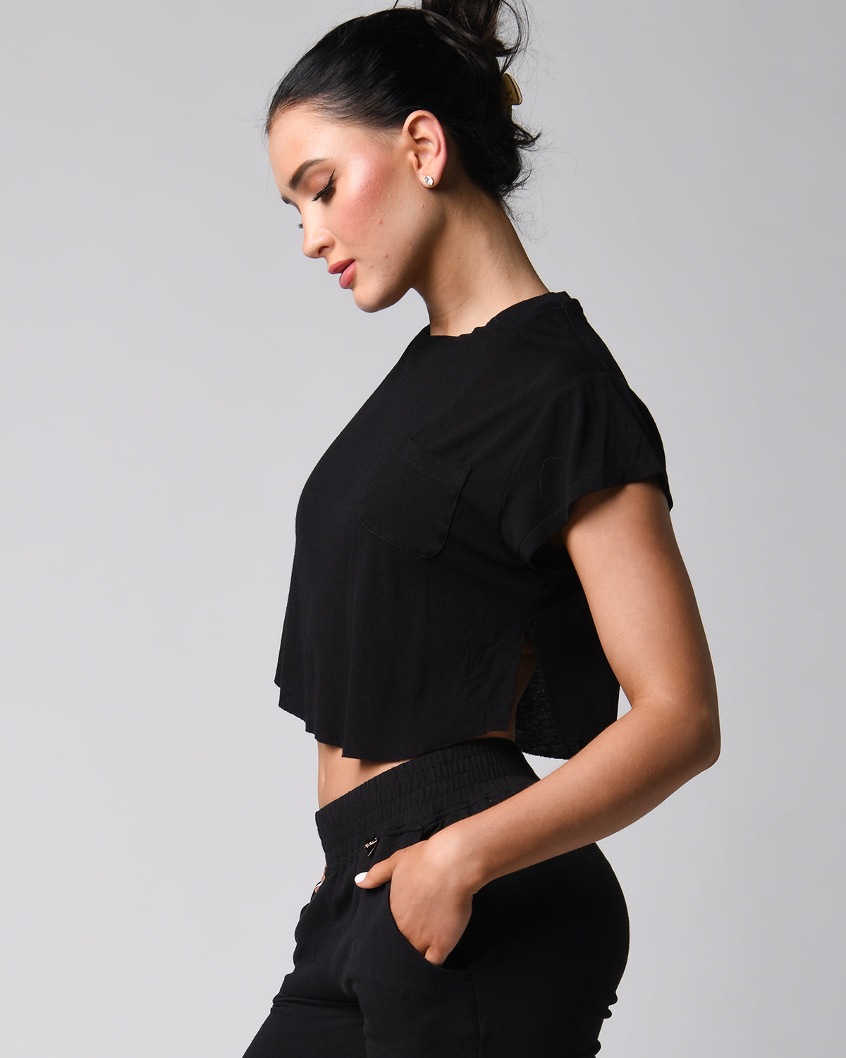 Right side view of the black *The Flutter Tee* (Perfect Pocket Tee)