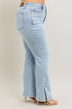 Light blue jeans worn by a person on a beige background