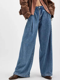 Wide-leg jeans worn by a person on a white background