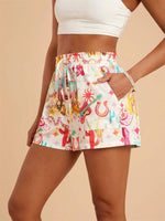 Colorful patterned skirt worn by a person on a beige background