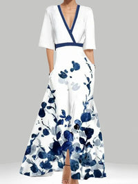 White dress with blue floral pattern on a gray background