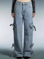 Blue jeans with tie details on a gray background