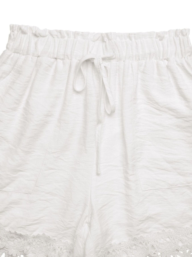 White textured pants with drawstring on a white background