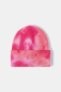 Pink tie-dye beanie on a white background