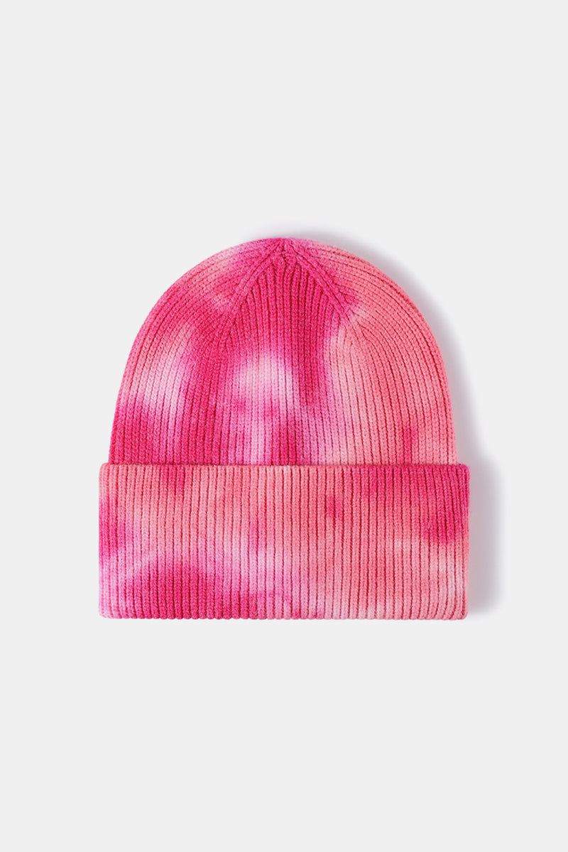 Pink tie-dye beanie on a white background