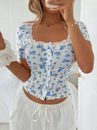 Woman wearing a floral top with a white background
