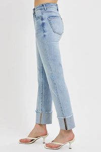 Light blue jeans worn by a person on a white background