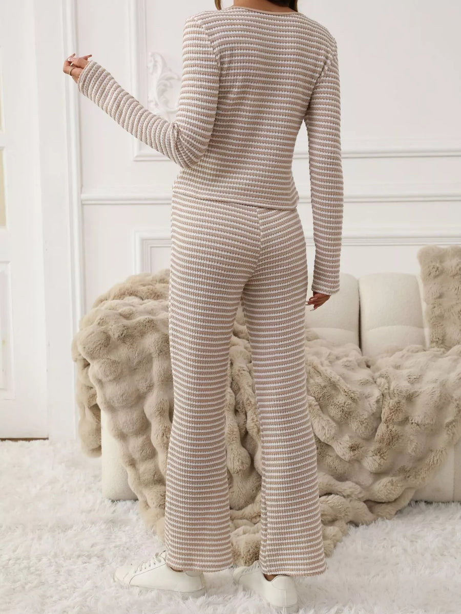 Person wearing a ribbed knit outfit in a cozy room with soft lighting.