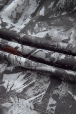 Close-up of fabric with black and white floral pattern