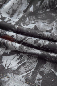 Close-up of fabric with black and white floral pattern