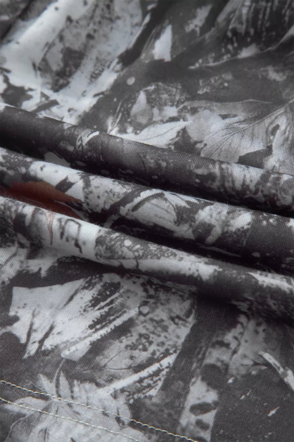 Close-up of fabric with black and white floral pattern