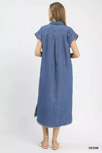 Woman wearing a denim dress on a white background