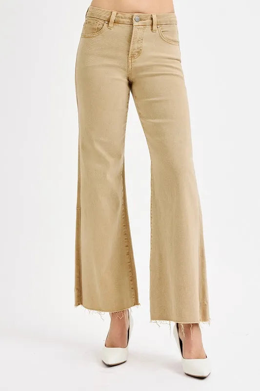 Beige flared jeans on a white background