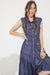 Model showing pockets of PLUS SLEEVELESS BUTTON DOWN COLLARED DENIM DRESS