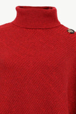 Red turtleneck sweater with a button on a white background