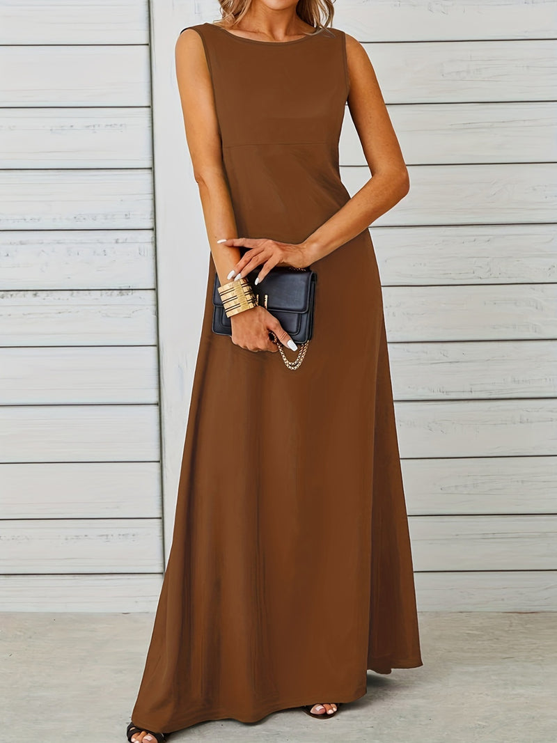 Woman wearing a brown sleeveless dress holding a black clutch against a wooden background