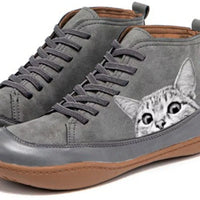 Gray high-top sneakers with a cat design on the side, on a white background