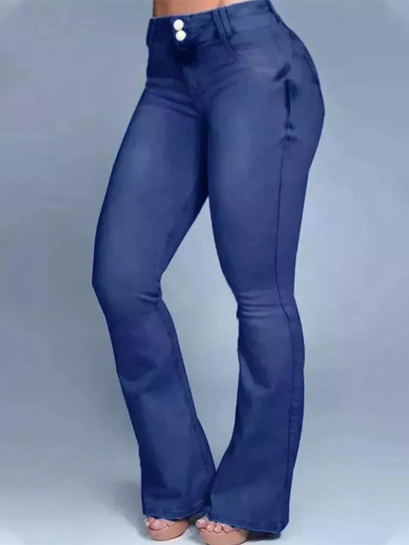 Blue bell-bottom pants on a gray background