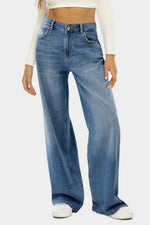 Person wearing blue jeans on a white background