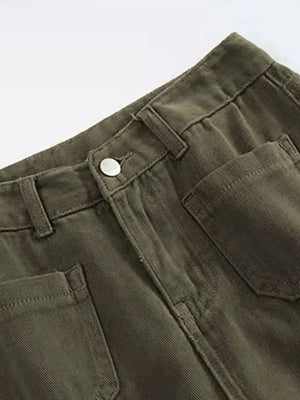 Close-up of green pants with a button and pocket on a white background