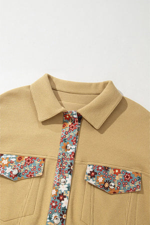 Beige shirt with floral pocket squares and tie on a white background