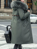 right side view of green Women's Detachable Longline Hooded Parka with Faux Fur Trim and Drawstring Waist