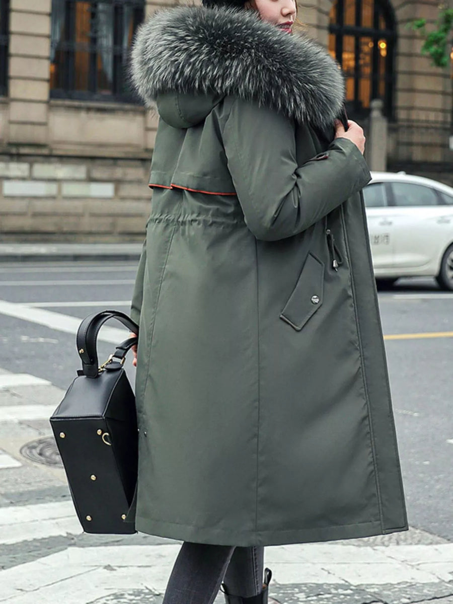 right side view of green Women's Detachable Longline Hooded Parka with Faux Fur Trim and Drawstring Waist